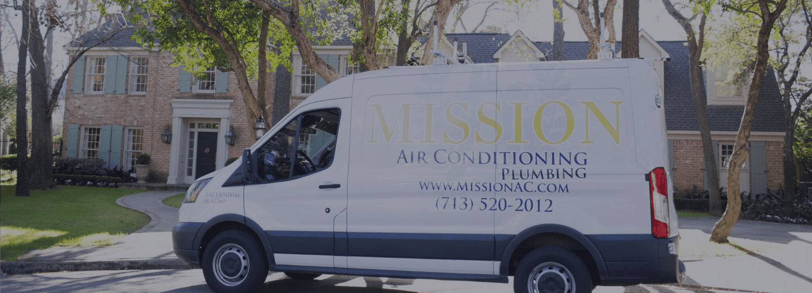 A branded Mission service van parked outside a Houston home